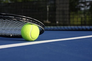 23756051 - tennis ball and racket on a blue modern court
